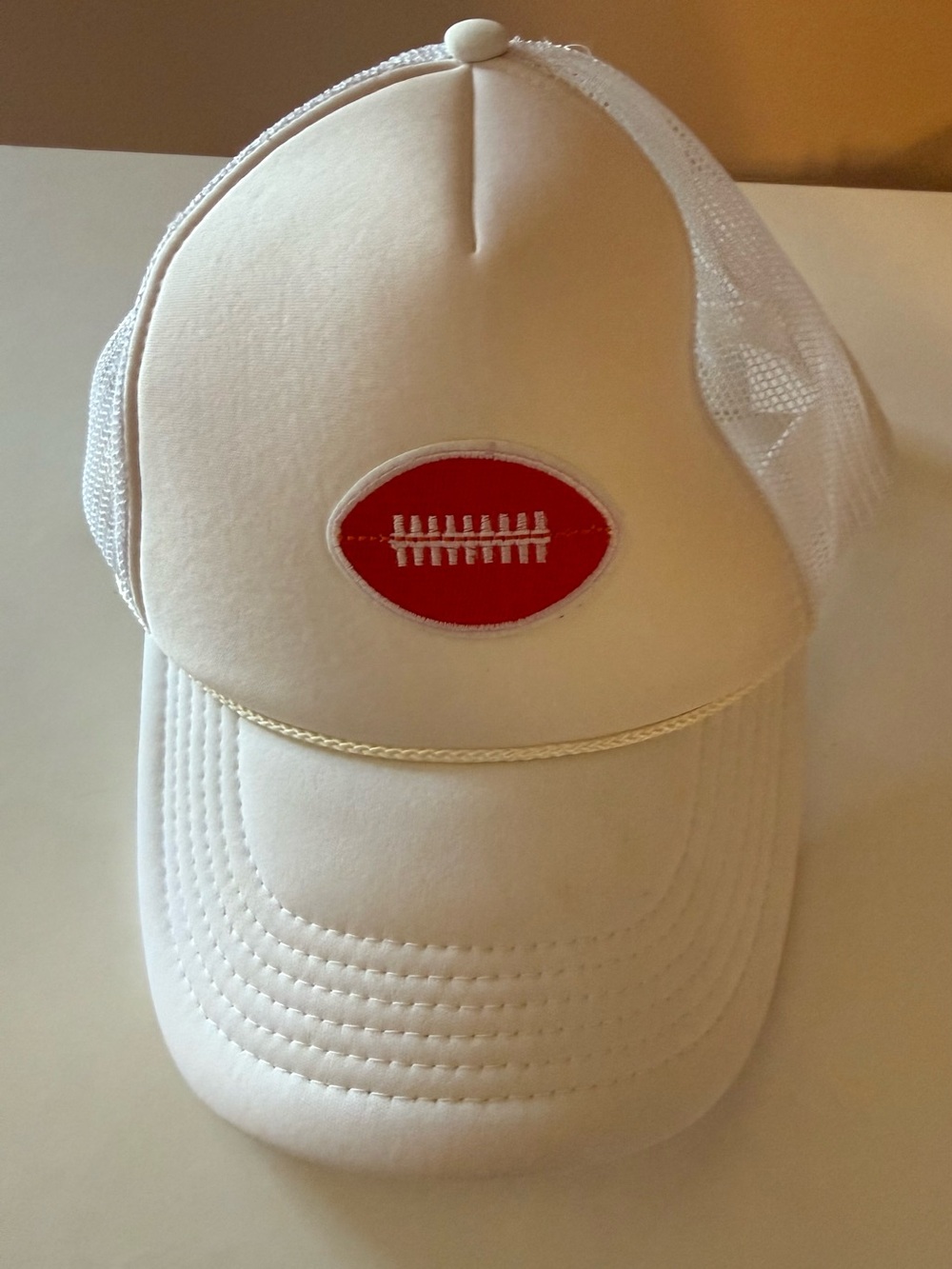 Trucker hat with crimson football